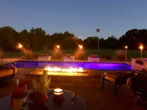 What is the purpose of a poolside fire pit
