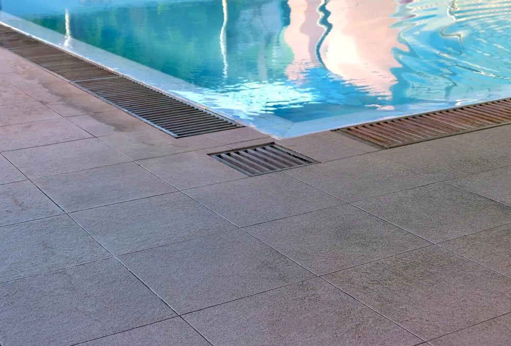 Why does backyard drainage matter when planning a pool?